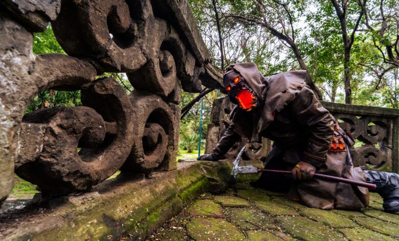 Spooky Halloween cosplay set in a lush Mexican forest with stone ruins.