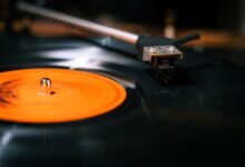 Elegant close-up of a rotating vinyl record on a turntable, focusing on the needle.