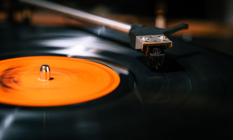Elegant close-up of a rotating vinyl record on a turntable, focusing on the needle.