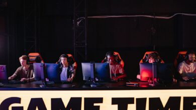 A group of diverse gamers participating in an online eSports tournament indoors.