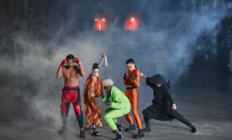 Dynamic group of diverse cosplayers striking action poses in an atmospheric indoor setting with smoke.