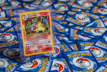 High-value Charizard Pokémon trading card surrounded by various other cards.