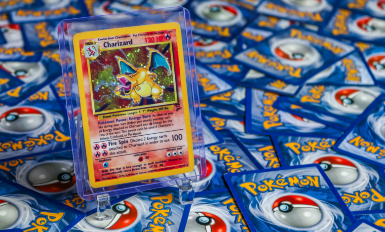 High-value Charizard Pokémon trading card surrounded by various other cards.