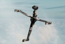 A futuristic spaceship floating above a sea of clouds showcasing modern design.