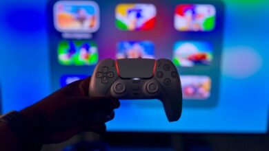 Close-up of a gaming controller against a vibrant screen in London, England.