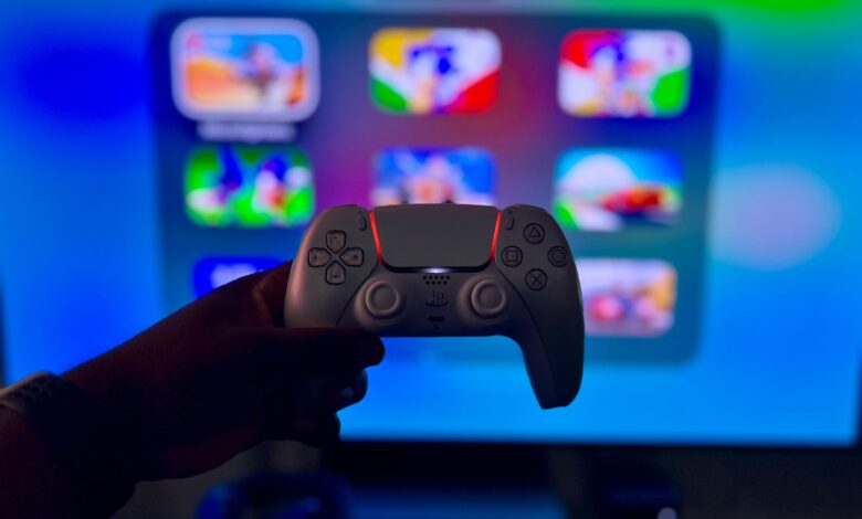 Close-up of a gaming controller against a vibrant screen in London, England.