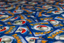 A vibrant display of Pokémon trading cards featuring the iconic Pokeball design.