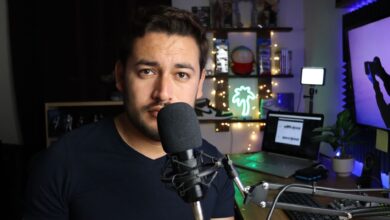 Podcaster in a stylish home studio with microphone and neon lights in Santiago de Querétaro, Mexico.