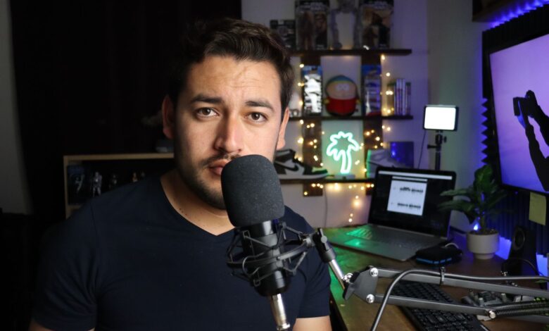 Podcaster in a stylish home studio with microphone and neon lights in Santiago de Querétaro, Mexico.