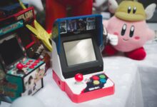 A collection of vintage arcade consoles and toys set in Tunis, Tunisia, evoking nostalgia.