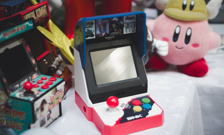 A collection of vintage arcade consoles and toys set in Tunis, Tunisia, evoking nostalgia.