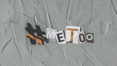 Text art 'MeToo' on concrete background highlighting social movement themes.