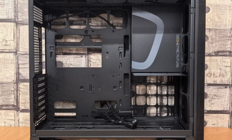 Black open computer case with visible interior and geometric design, ideal for DIY builds.