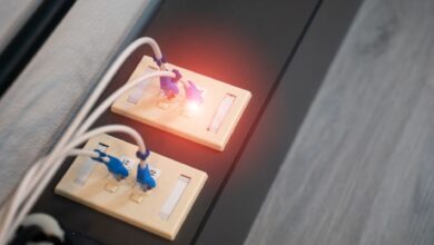 Close-up view of Ethernet ports with cables and illuminated LED indicator. Modern data connection setup.