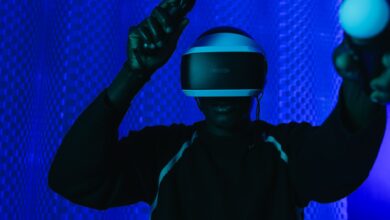 Person enjoying a virtual reality gaming session with a VR headset and controllers.