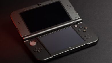 Detailed photo of a Nintendo 3DS console with dual screens and buttons, perfect for gaming enthusiasts.