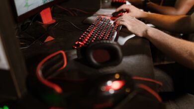 Close-up of gamers using mechanical keyboards during an intense esports session.