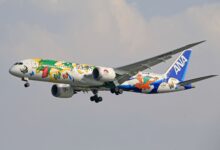 ANA airplane decorated with Pokémon artwork in flight, showcasing vibrant character designs.