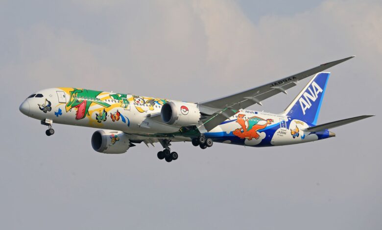 ANA airplane decorated with Pokémon artwork in flight, showcasing vibrant character designs.