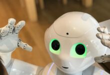 A futuristic humanoid robot with glowing green eyes in a modern setting.