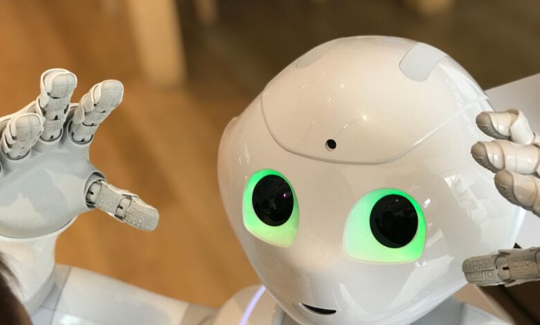 A futuristic humanoid robot with glowing green eyes in a modern setting.