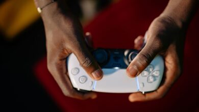 Close-up view of hands gripping a wireless gaming controller.