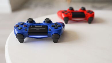 Close-up of PlayStation controllers on a white table for gaming enthusiasts.