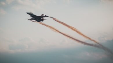 Dynamic capture of a military fighter jet soaring through a cloudy sky.