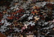 A detailed view of various colored puzzle pieces forming a complex pattern.
