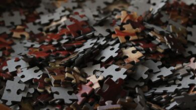 A detailed view of various colored puzzle pieces forming a complex pattern.