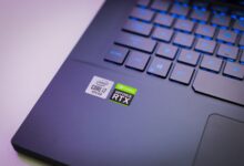 Laptop keyboard with Intel Core i7 and NVIDIA GeForce RTX stickers, symbolizing high-performance computing power.