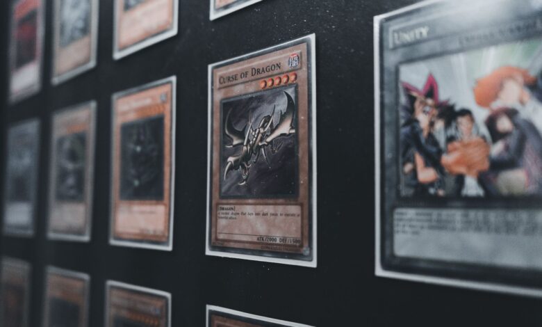A close-up view of Yu-Gi-Oh! trading cards in a display case showcasing rare and collectible cards.