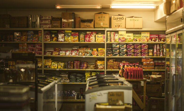 Shelf packed with diverse Asian snacks and groceries in an inviting store setting.