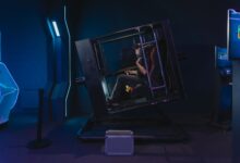 A person using a VR simulator in a high-tech gaming environment.