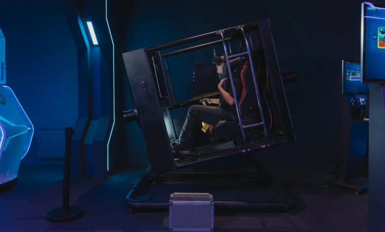 A person using a VR simulator in a high-tech gaming environment.