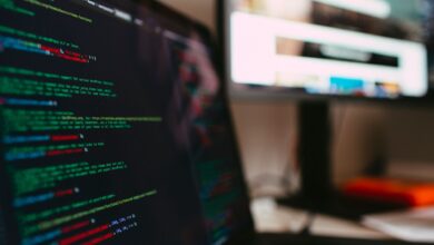 A detailed view of programming code displayed on a laptop screen, depicting a tech workspace.
