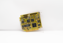 Antique circuit board showcasing vintage computing technology, isolated on a white background.