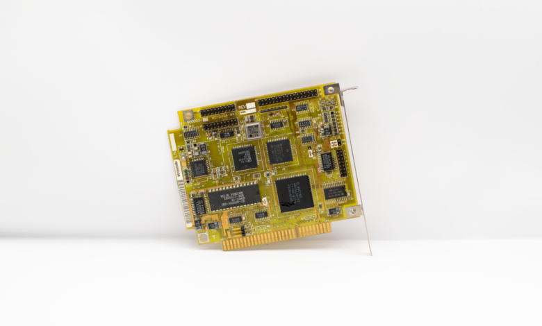 Antique circuit board showcasing vintage computing technology, isolated on a white background.
