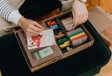 Close-up of a board game setup being organized for a fun leisure activity.