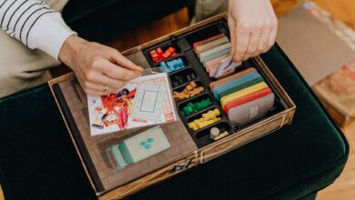 Close-up of a board game setup being organized for a fun leisure activity.