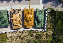 Drone shot of military tanks displayed outdoors at a museum in Jerusalem, Israel.