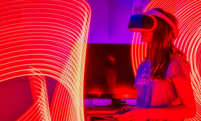 Woman immersed in virtual reality while surrounded by dynamic neon lights indoors.
