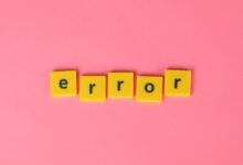 Yellow block letters spelling 'error' on a vibrant pink background, capturing a playful message.