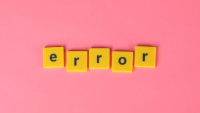 Yellow block letters spelling 'error' on a vibrant pink background, capturing a playful message.