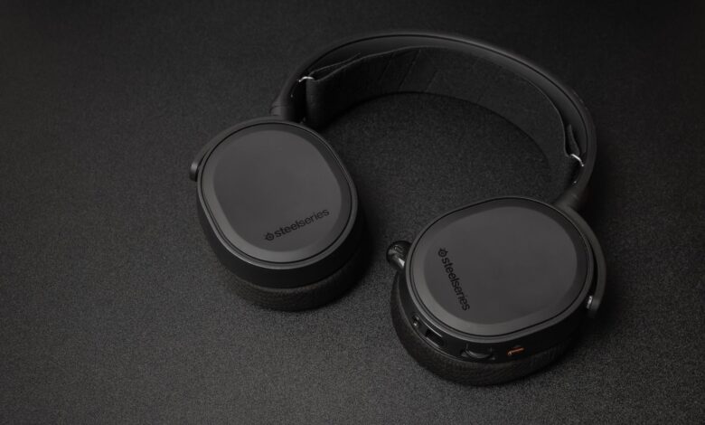 Close-up of SteelSeries headphones on a black surface. Minimalist and sleek.