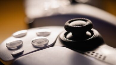 Detailed close-up of a video game controller with focus on buttons and joystick.