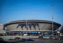 Spodek Arena in Katowice featuring a vibrant esports event atmosphere with banners.