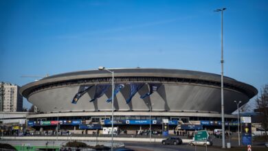 Spodek Arena in Katowice featuring a vibrant esports event atmosphere with banners.