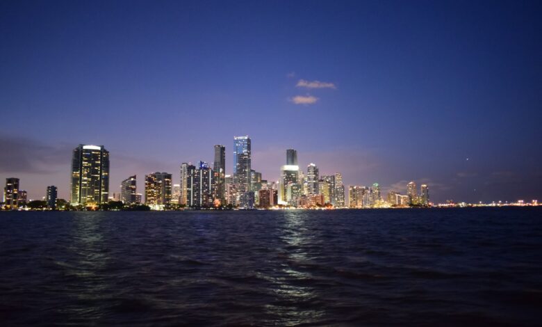 Breathtaking view of Miami's skyline reflecting on Biscayne Bay at twilight.