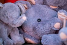 Charming close-up of plush elephant toys showcasing their soft textures and vibrant colors.
